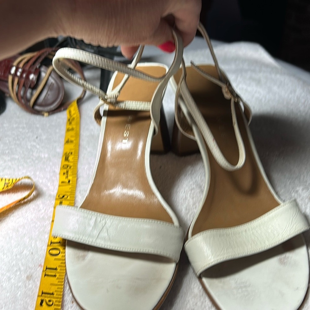 Nine West Ladies, high heel white strapping. 7.5 healed sandal, good condition.